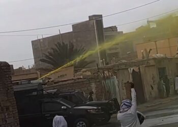 An image provided by an eyewitness on Friday 20 October 2023 shows a water cannon spraying yellow liquid to disperse protests and facilitate subsequent arrest of marked protesters.