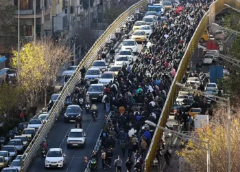 Protesters march in downtown Tehran