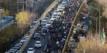 Protesters march in downtown Tehran